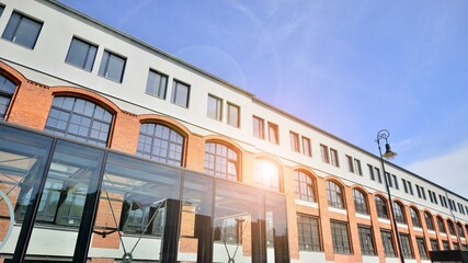 Obraz premium Modern office building with white metallic panel facade and windows. Modern architectural details.