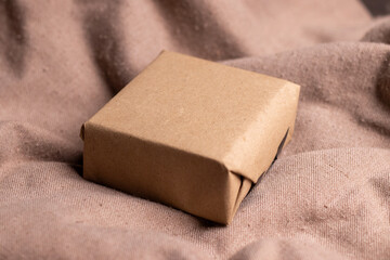 Closeup of a brown color girf box kept on a  brown background