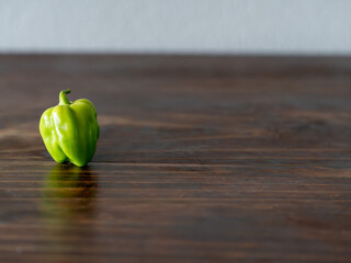 Green panamenian pepper on wooden table