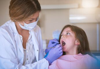 Girl, woman dentist and dental checking with oral hygiene and teeth care with patient and mouth...