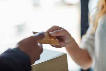 Credit card, delivery man and hands of woman with package, online shopping sales and distribution...