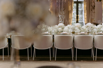 Luxury table with the bouquet of flowers. decorated festive table with chairs