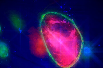 Abstract spots are a glowing blue-red sphere on a dark background.