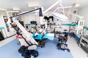 A hospital room with a robot operating on a patient. The robot is in the middle of the room and is surrounded by medical equipment - Powered by Adobe