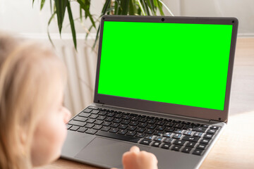 preschool girl studying distance learning course, using computer for self-education and...