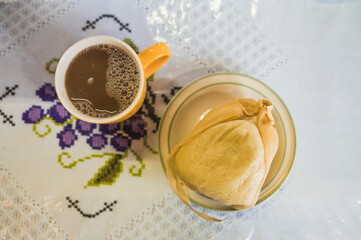 Delicious bread tamale, accompanied by tamarind atole, typical food from Uruapan, Michoacan, Mexico.