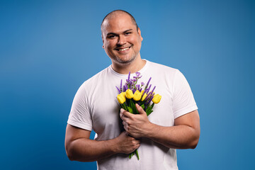 man holding a bouquet with both hands