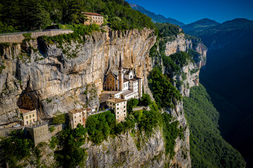 Aerial View of Madonna della Corona, Cliffside Sanctuary in Italy's Veneto, Surrounded by Dramatic Alpine Scenery