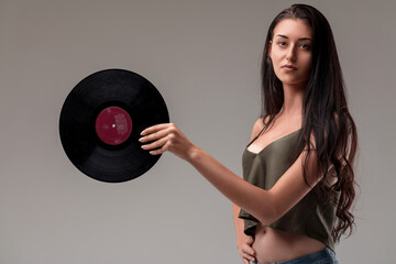 Confident woman holds vinyl, style and grace