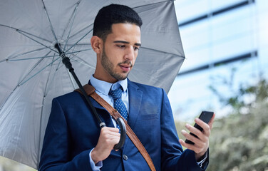Businessman, phone and umbrella with communication in city for justice, advocate for legal with...