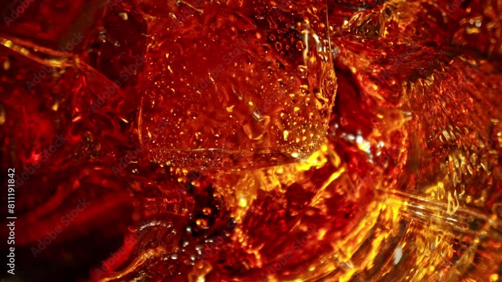 Poster super slow motion of falling ice cube into cola drink. filmed on high speed cinema camera, 1000 fps,
