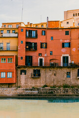 Colourful buildings by river in Girona