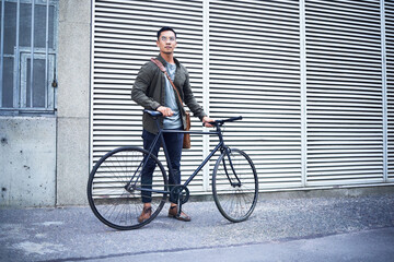 Travel, fashion and man with bicycle in city commuting to work for creative career. Transport,...