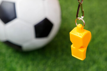 Soccer football whistle referee with soccer field background