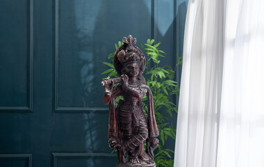Lord Krishna sculpture, Happy Janmashtami and Vishu greeting	