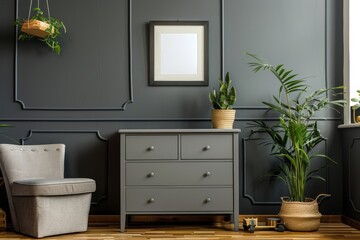 A gray dresser with a chair in front of it