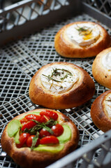 Baked camembert in brioche with honey and rosemary, and sun-dried tomatoes, from artisan bakery