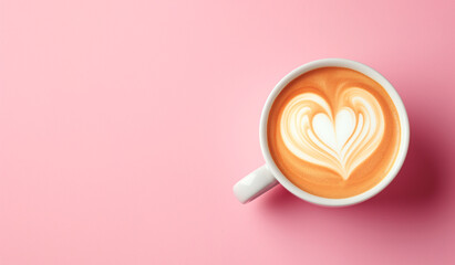 White cup with coffee art on pink background