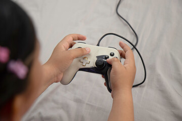 Latin girl hands holding joystick playing in bedroom © caav