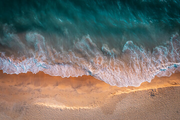 Beautiful beach aerial landscape image, beach waves rolling into the shore, tropical beach drone view 