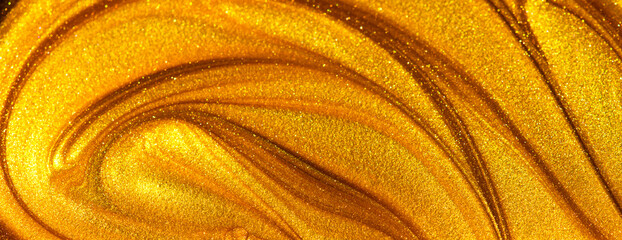 Beautiful abstract golden liquid paint background, beauty gold backdrop texture. Metallic gold...