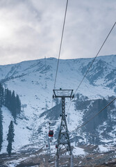 Gondola ride from Gulmarg, Famous cable car ride view from Kashmir, Snow covered mountain range with ropeway adventure activity, Winter landscape scenery