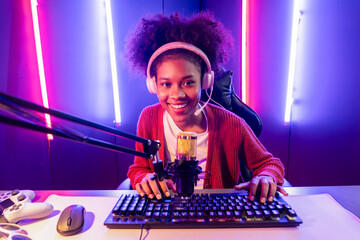 Host channel of gaming streamer, African girl taking, typing with Esport skilled team player and...