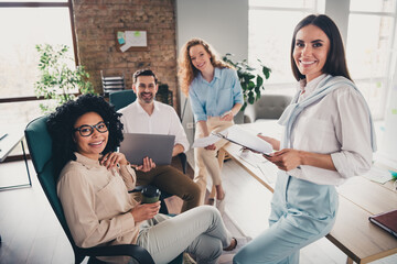 Portrait of group professional corporate workers project discussion loft interior business center indoors