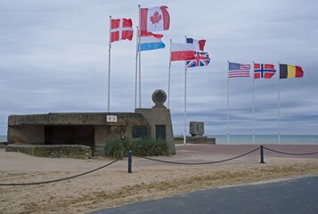 Bernieres-sur-Mer, France - May 1, 2024: Juno Beach D-Day Landing Memorial. Cassine bunker. Queen's Own Rifles of Canada memorial. Cloudy spring day. Selective focus.