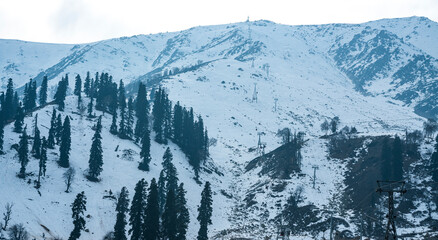 Snow covered mountain peaks in Kashmir, Beautiful mountain landscape view from Gulmarg, Jammu and Kashmir Travel and tourism concept nature image