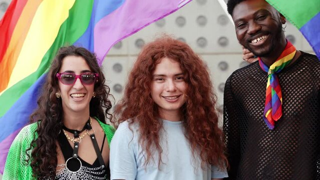 Group portrait of smiling friends celebrating gay pride festival - Gender Diversity Equality