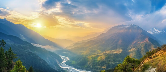 mountains and valleys with a river in the foreground and a sun setting