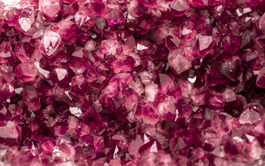 Amethyst garnet crystals. Burgundy gemstone. Mineral crystals in the natural environment. Texture...