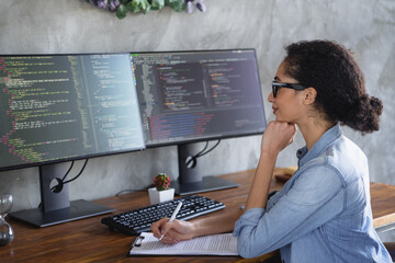 Profile portrait of young girl it specialist hold pen clipboard look monitor loft interior business...