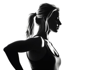 A black and white image of a woman wearing a sports bra