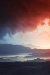 mountains and cloudy dramatic sunset sky landscape