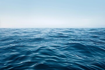 Fototapeta premium A minimalist ocean background, featuring a calm sea surface with subtle wave textures, offering a clean and uncluttered space for copy