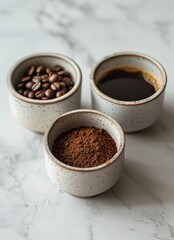 Three Small Bowls Filled With Different Types of Coffee