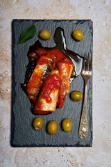 Sardines with tomato and olives