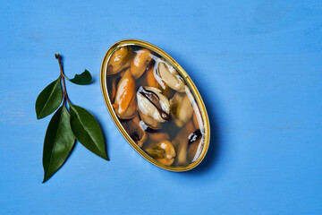 Canned mussels with blue background