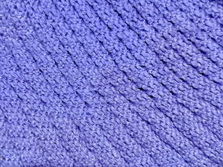 Close up purple knitted wool fabric fiber texture background