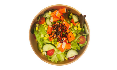 Bowl of healthy fresh salad with crab stick and vegetables
