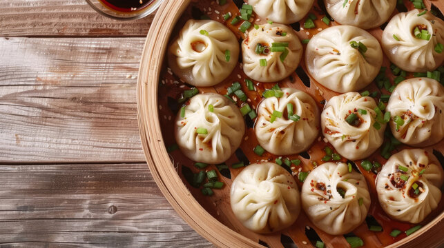 Traditional mongolian buuz: authentic steamed dumplings served in a bamboo steamer with chives and chili flakes garnish