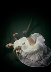 dancer lying on the floor with her legs up in a desolate attitude IV © livcool