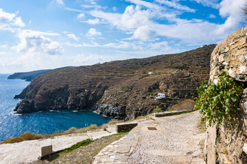 Path to sea bay in Kastro village with mountains in background, Sifnos island, Greece
