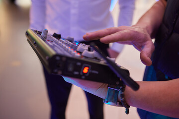 A person is holding an electronic device in electric blue color