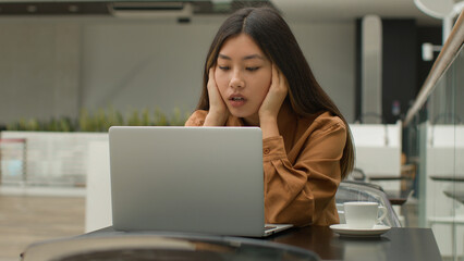 Stressed tired Asian woman female office worker businesswoman chinese korean japanese girl...