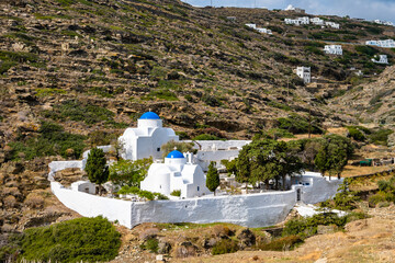 Monastery with white church with blue dome near Kastro village, Sifnos island, Greece