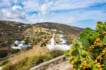 Cacti plants on path around Kastro village and view of mountain landscape with windmills and...