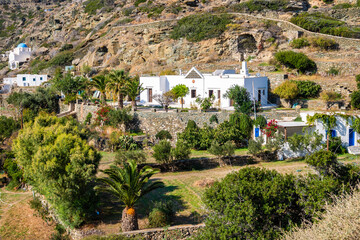 View of Greek farm with white house and garden in mountain landscape near Kastro village, Sifnos...